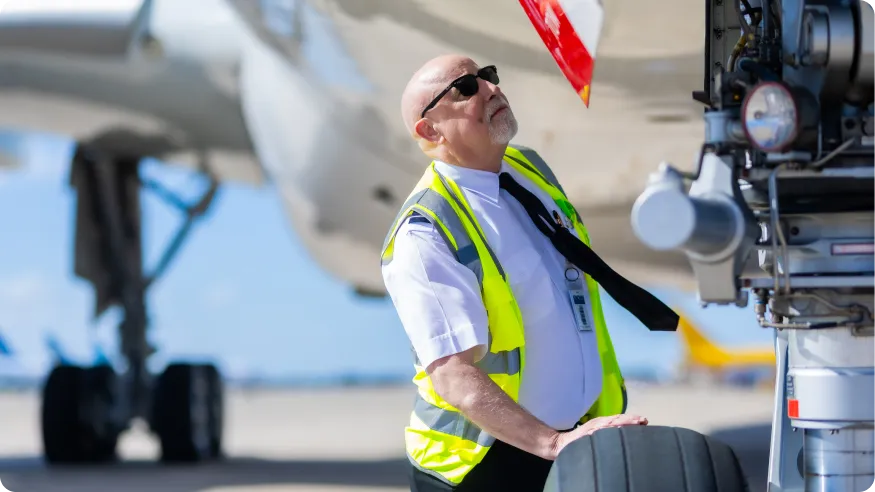 A person inspecting an airplane